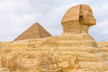 The great pyramid of Cheops and Sphinx in Giza plateau. Cairo, Egypt