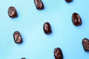 Sweet dried dates on color background