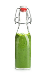 Bottle of healthy vegetable juice on white background