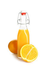 Bottle of healthy orange juice on white background