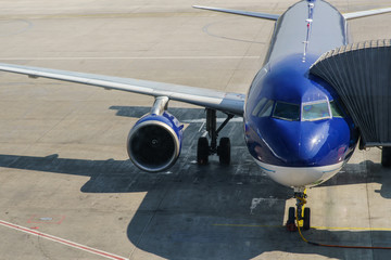 Passenger plane in the airport . Aircraft maintenance.