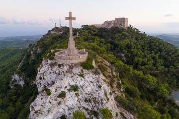 Aerial view of Sant Salvador Sanctuary and monolith cross, Mallorca island, Spain