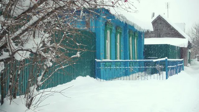 Wooden russian house in winter.