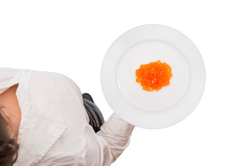 Top view of a waitress in a white blouse carrying plate with red salmon caviar on the white background. Concept. Isolated