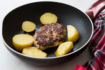 Homemade Salmon Meatball with Potatoes in Pan.