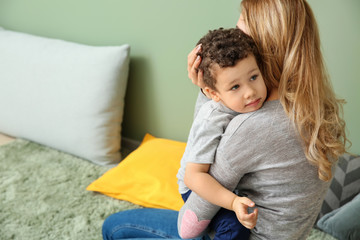 Cute little boy with mother at home