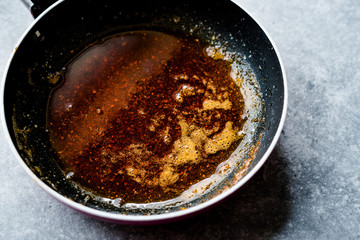 Preparing Red Sauce with Frying Melted Butter and Spices in Pan / Cooking Recipe.