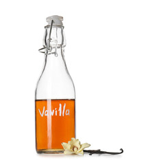 Glass bottle of vanilla extract on white background