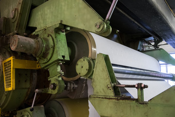 A roll of paper installed in a typographic machine.