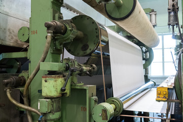 A roll of paper installed in a typographic machine.