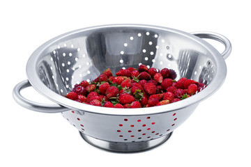 Colander with ripe strawberries isolated on white background.