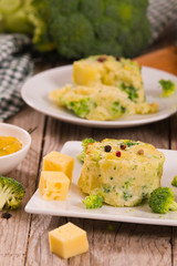Potato gratins with broccoli florets.