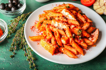 Tasty pasta with tomato sauce on plate
