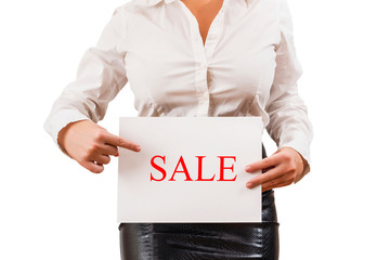 Business woman in the blouse holding white paper with word sale. Concept. White background.