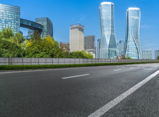 Fototapeta na wymiar Empty asphalt road through modern city in Shanghai, China.