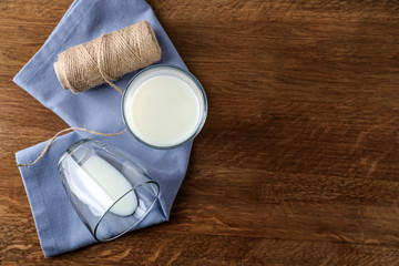 Composition with fresh milk on wooden table