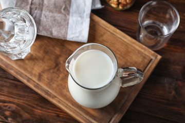 Obraz na płótnie Canvas Jug of fresh milk on table