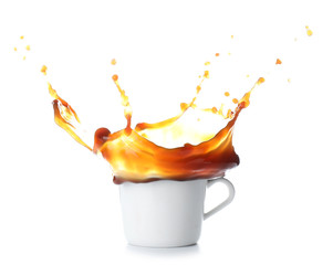 Splash of coffee in cup on white background