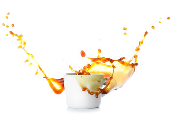 Splash of coffee in cup on white background