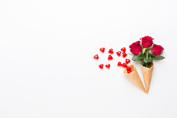 Flowers composition. Frame made of red rose on white background. Flat lay, top view, copy space.