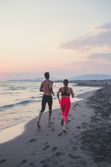 Couple Jogging by the Sea