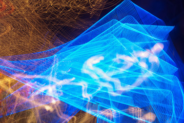 Abstract futuristic background color texture with lighting effect. Modern dynamic shiny pattern. Fractal graphic artwork design. Abstract lights at night. Creative long exposure photography
