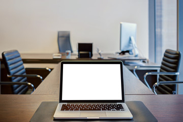  laptop with blank screen on the working place in the modern off