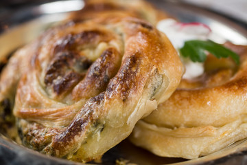 Homemade cheese and spinach pie on a  plate