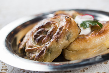 Homemade cheese and spinach pie on a  plate