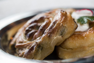 Homemade cheese and spinach pie on a  plate