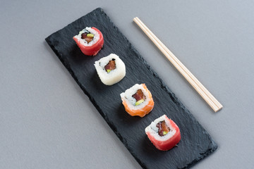  Sushi ready to eat on slate plate