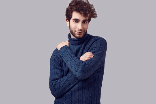 Handsome Elegant Man With Curly Hair In Blue Sweater