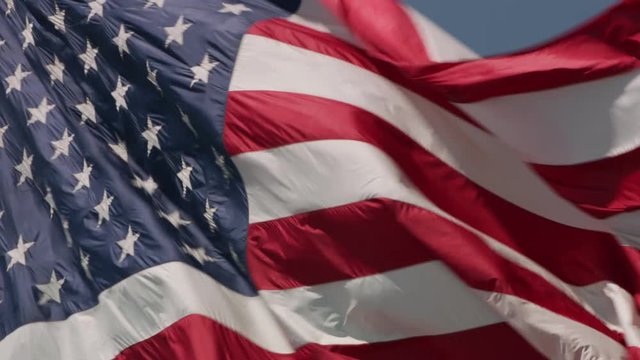 Close up shot of American Flag waving in wind