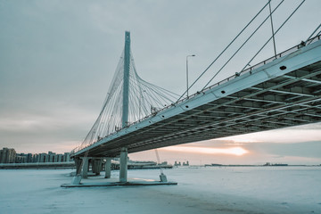 Bridge over the Neva River in winter sunset