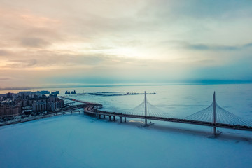 Bridge over the Neva River in winter sunset