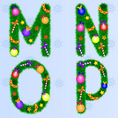 The alphabet from the branches of spruce with Christmas toys.Set of New Year fonts