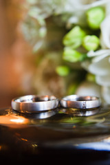Fototapeta na wymiar Wedding rings of the bride and groom, close up