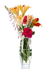 Blooming bouquet of flowers in a transparent vase with water. Isolated on white background.
