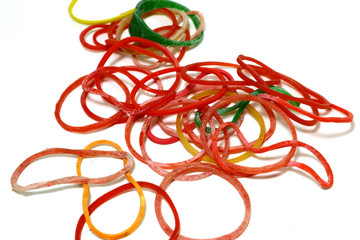 Many circular rubber skins have many colors placed on a white background.