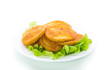 potato pancakes with lettuce leaves in a plate