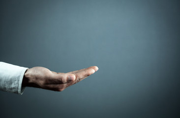 Businessman showing empty hand.