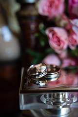 Fototapeta na wymiar Gold wedding rings with diamonds, close-up