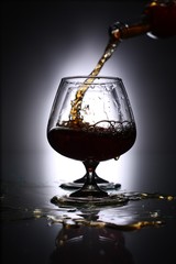 pouring brandy into a glass