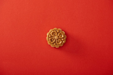 Fototapeta na wymiar top view of traditional chinese mooncake isolated on red