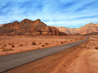 Asphalt road in red israeli desert