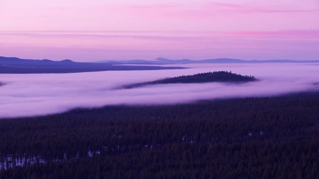 Oregon circa-2018. Low lying fog at sunrise, Deschutes National Forest. Shot from helicopter with Cineflex gimbal and RED Epic-W camera.
