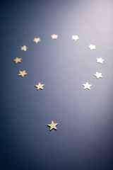 Europe Union symbol - golden stars on blue background. Separated star represents BREXIT.