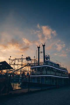 Tourist&nbsp;ship and roller coaster in entertainment park