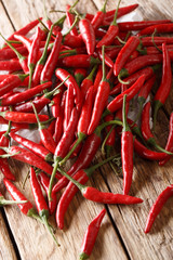 Wild hot chili pepper piri piri closeup on a table. vertical