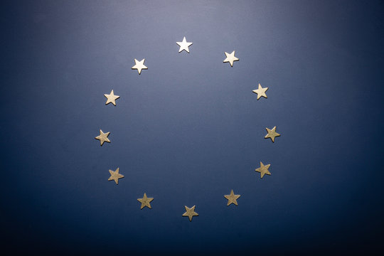 Europe Union symbol - golden stars on blue background. BREXIT crisis.